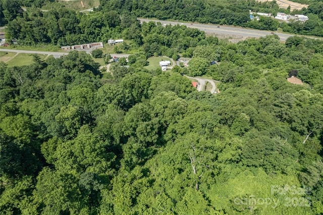 bird's eye view featuring a forest view