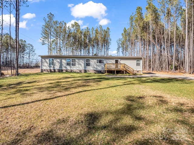 view of front of home with a deck, crawl space, and a front yard