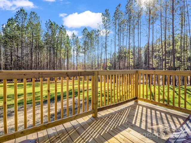 deck featuring a lawn