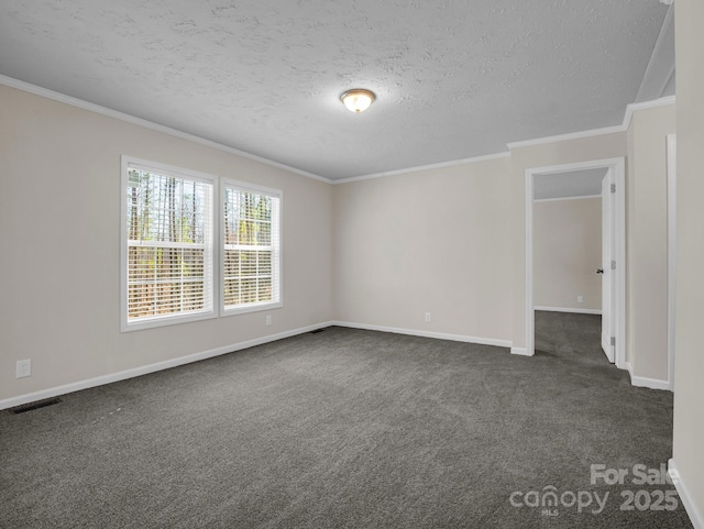 empty room with crown molding, dark colored carpet, visible vents, a textured ceiling, and baseboards