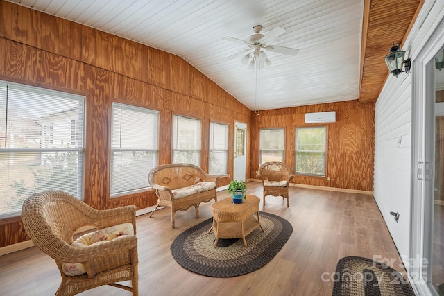 sunroom featuring wooden ceiling, an AC wall unit, ceiling fan, and vaulted ceiling