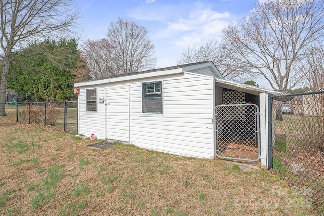 view of outbuilding with an outbuilding and fence