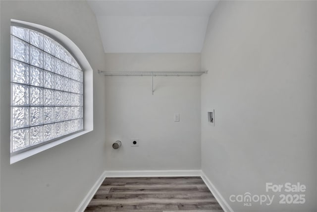 laundry room with laundry area, washer hookup, wood finished floors, and baseboards