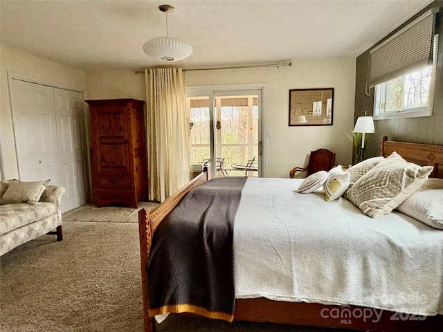 bedroom featuring access to outside and carpet