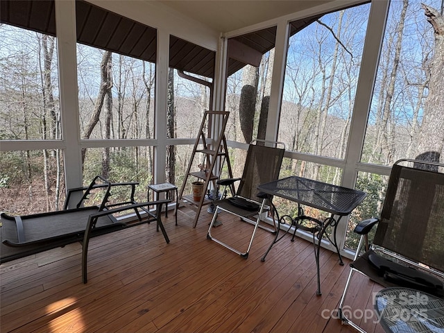 sunroom / solarium featuring plenty of natural light