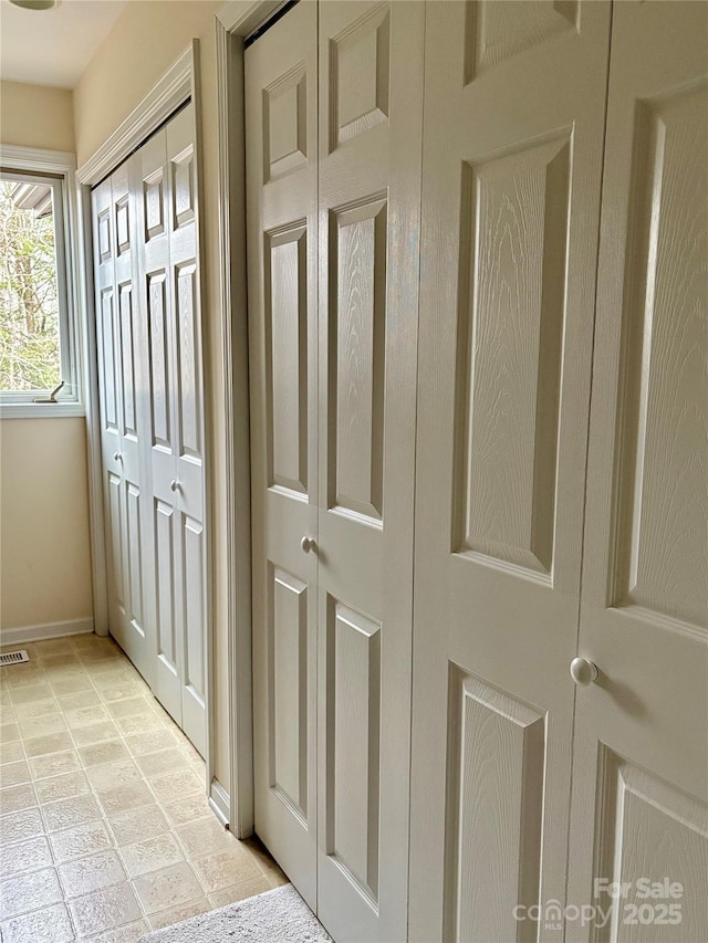 interior space with visible vents and baseboards