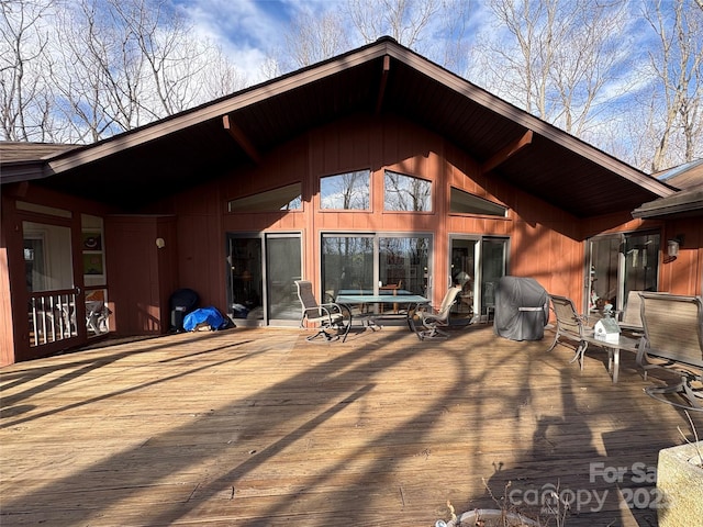 rear view of house with a wooden deck