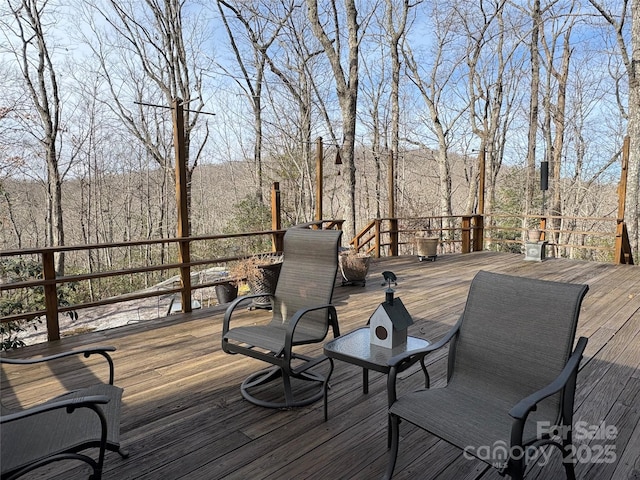 deck featuring a forest view