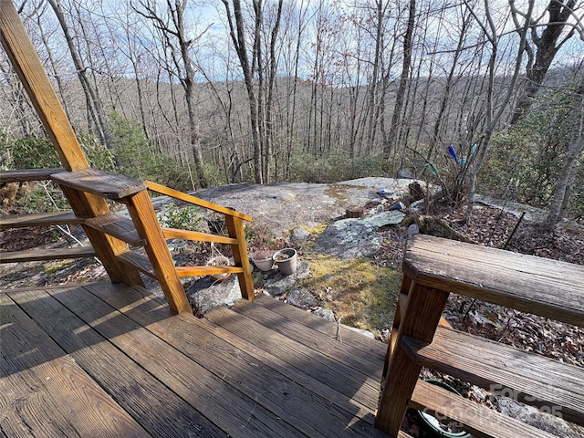 deck with a wooded view