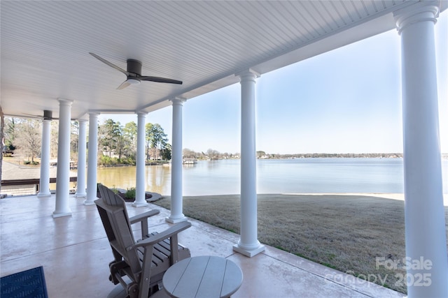 view of patio / terrace featuring a water view and a ceiling fan