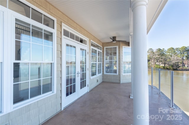 view of patio with french doors and ceiling fan