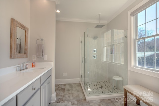 bathroom with a shower stall and crown molding