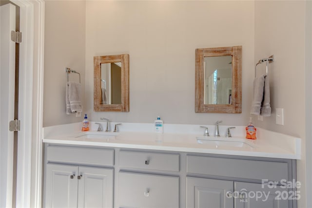 bathroom with double vanity and a sink