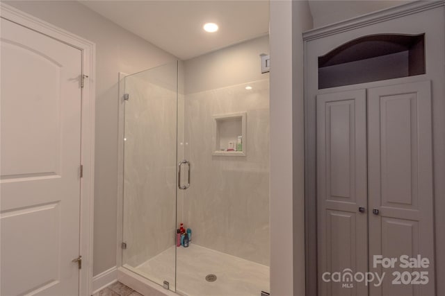 full bathroom with recessed lighting and a stall shower