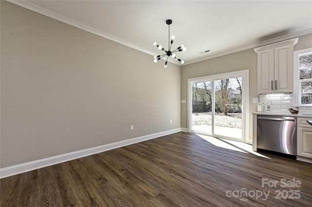 unfurnished dining area with baseboards, dark wood-type flooring, an inviting chandelier, and crown molding