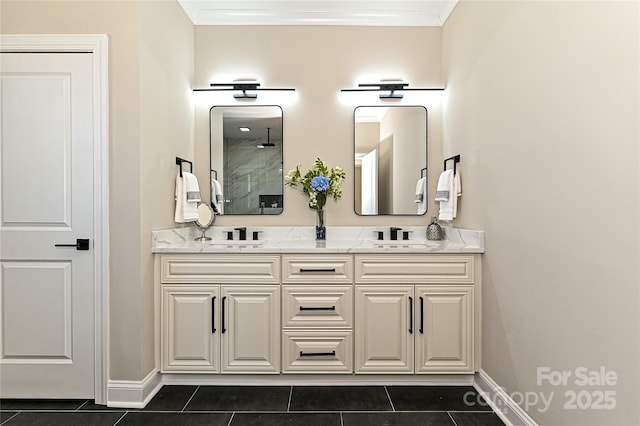 full bathroom featuring double vanity, tile patterned flooring, ornamental molding, and a sink