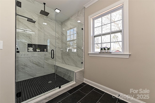 full bath featuring tile patterned flooring, a shower stall, and baseboards