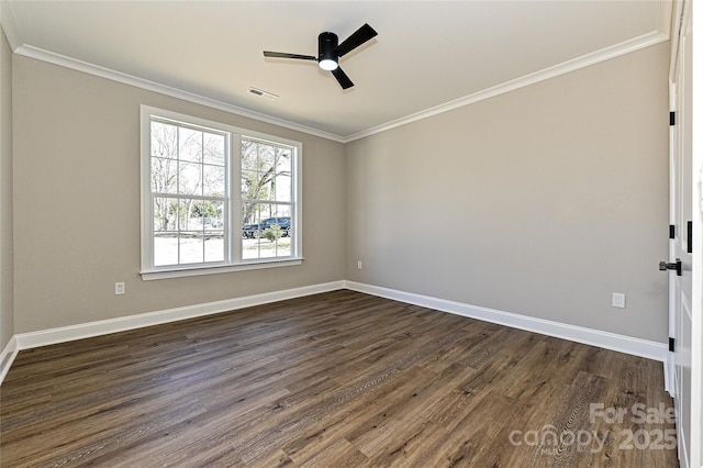 spare room featuring crown molding, visible vents, dark wood-type flooring, ceiling fan, and baseboards