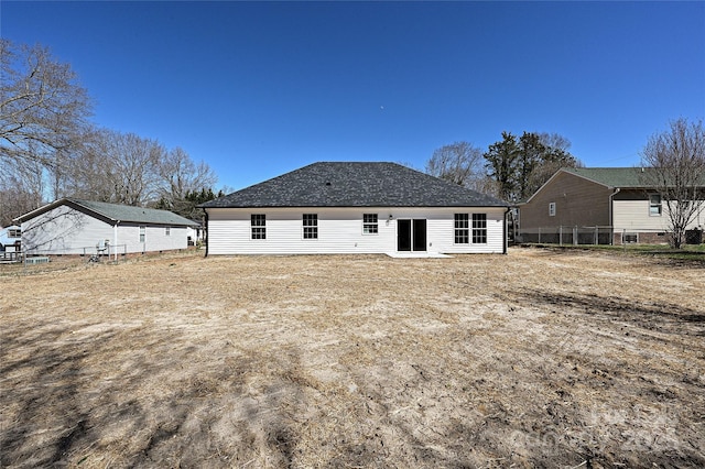 back of property featuring fence