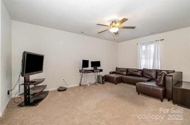 carpeted living area featuring baseboards, visible vents, and a ceiling fan