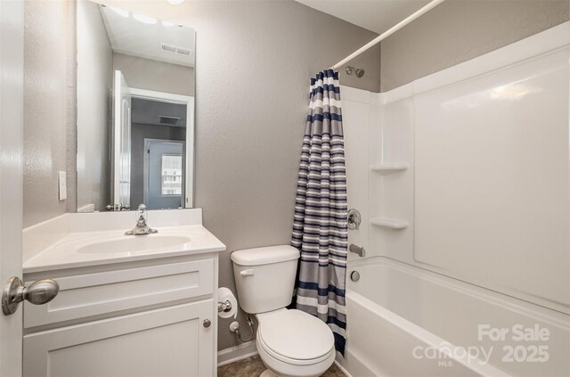 bathroom with toilet, visible vents, shower / bath combo with shower curtain, and vanity