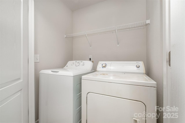 laundry area with washing machine and dryer and laundry area