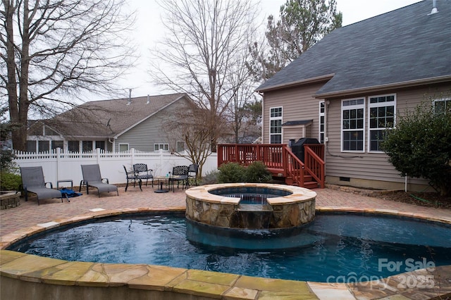 view of swimming pool featuring a fenced in pool, a patio, an in ground hot tub, fence, and a wooden deck