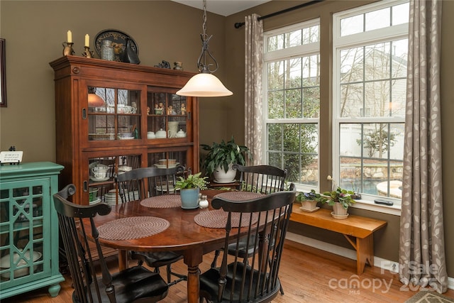 dining space with light wood-style floors