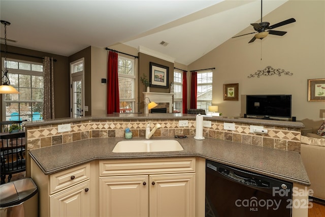 kitchen with a sink, visible vents, open floor plan, dishwasher, and dark countertops