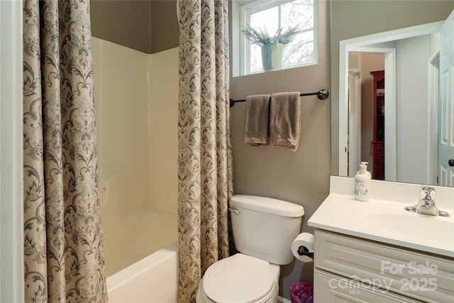 full bath featuring toilet, shower / tub combo, and vanity