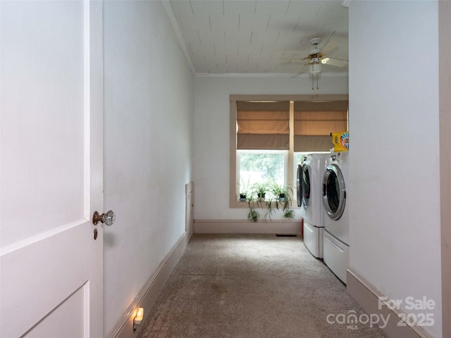 laundry area featuring laundry area, baseboards, ceiling fan, washing machine and clothes dryer, and carpet flooring