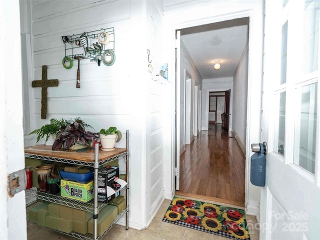 hall with tile patterned flooring