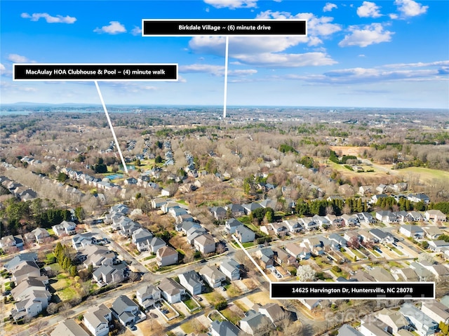 birds eye view of property with a residential view