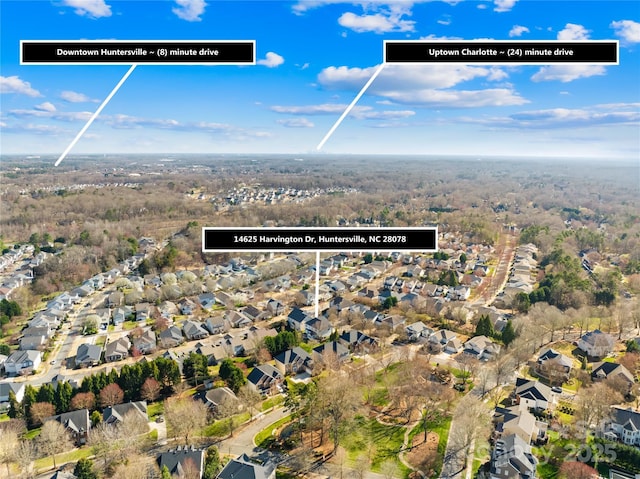 birds eye view of property with a residential view