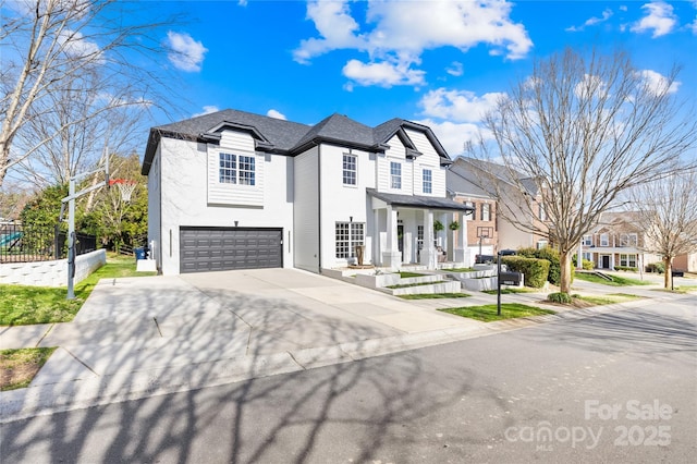 french provincial home with driveway, fence, a residential view, a shingled roof, and a garage