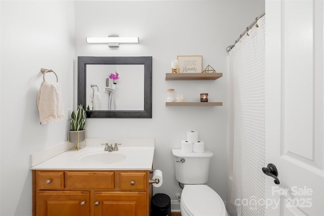 full bathroom with vanity and toilet