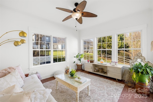 sunroom with ceiling fan