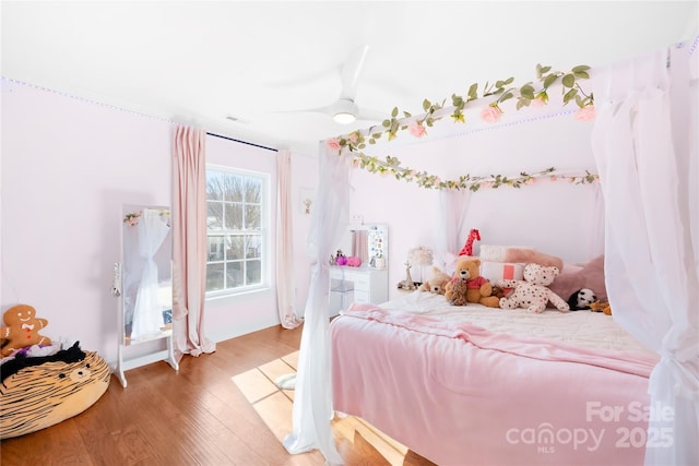 bedroom with wood finished floors