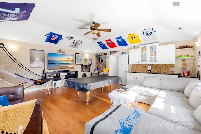 playroom with light wood finished floors, visible vents, ceiling fan, vaulted ceiling, and billiards