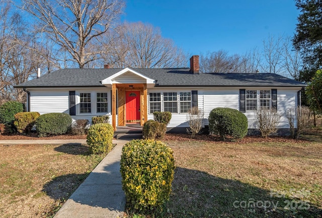 single story home featuring a chimney, a front yard, and a shingled roof