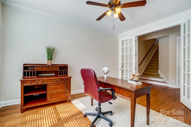 office with ornamental molding, baseboards, and wood finished floors