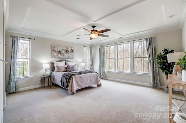 bedroom featuring carpet flooring, visible vents, a ceiling fan, baseboards, and a raised ceiling