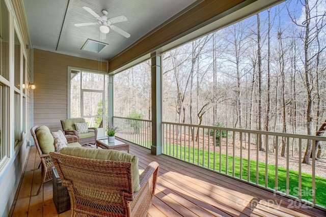 sunroom with a ceiling fan