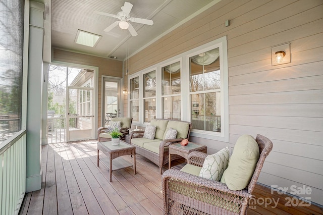 sunroom / solarium with ceiling fan