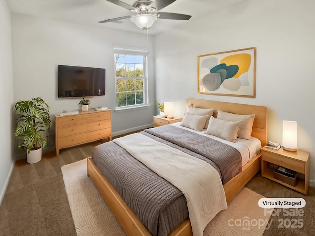 bedroom with ceiling fan and baseboards