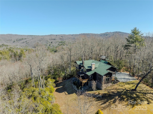 aerial view featuring a wooded view