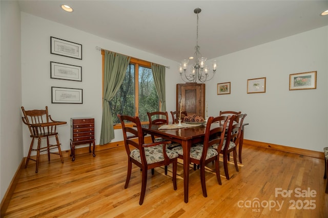 dining room featuring a chandelier, recessed lighting, light wood-style flooring, and baseboards