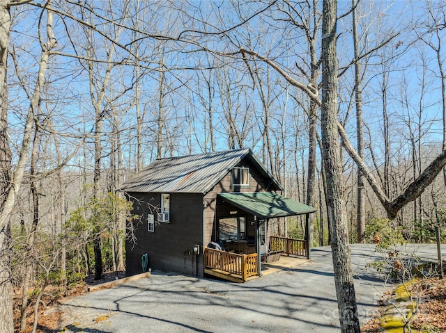 view of home's exterior featuring metal roof