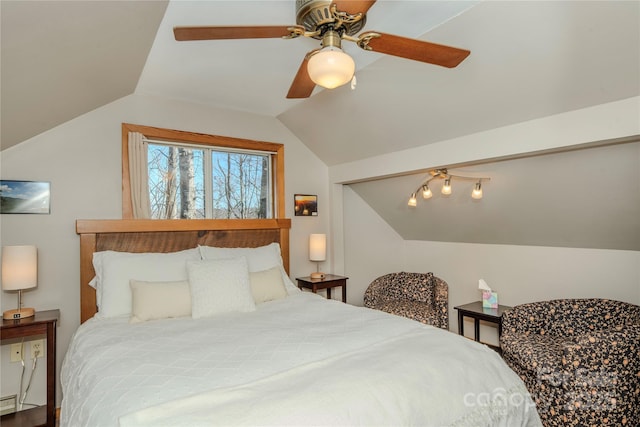 bedroom featuring lofted ceiling, a ceiling fan, and a baseboard radiator