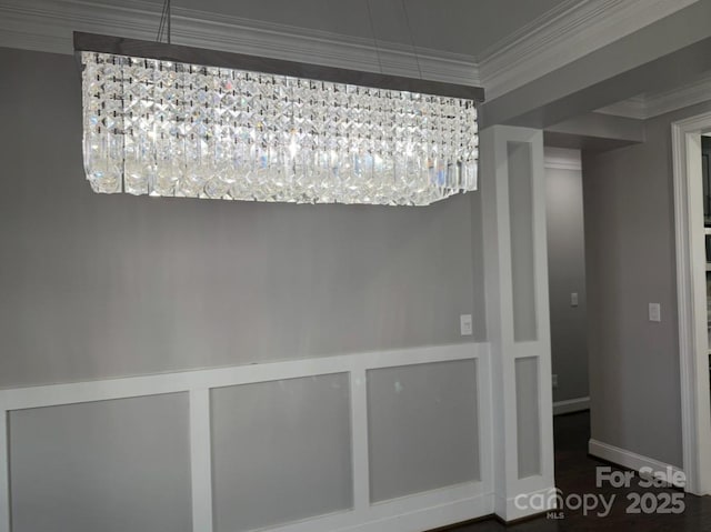 unfurnished dining area with ornamental molding